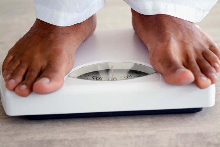 weighing scale black man